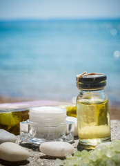 Natural facial cream and sea as background 
