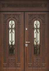 The iron door with a wooden pattern.