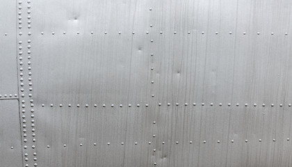 Aluminum metal texture with rivets. Metallic background.
