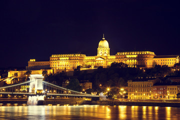 Fototapeta na wymiar Night view of Chain bridge and royal palace in Budapest, Hungary, Vintage look