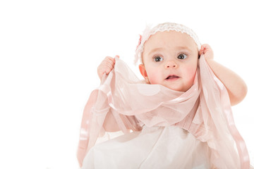 Portrait of beautiful young girl posing with her pink dress shot against white background with copy paste