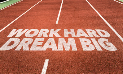 Work Hard Dream Big written on running track