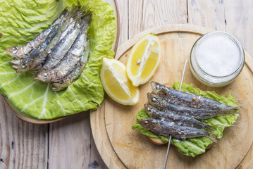Sandwich with sardines, sprats with parsley and dill