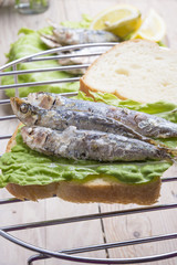 Sandwich Kamut, tapas with sardines, sprats with olives and herb