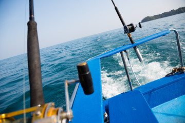 Fototapeta na wymiar Fishing trolling a motor boat in Andaman Sea, coast Thailand