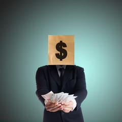 Businessman holding money with a paper bag on head,Abstract of c - 103473944