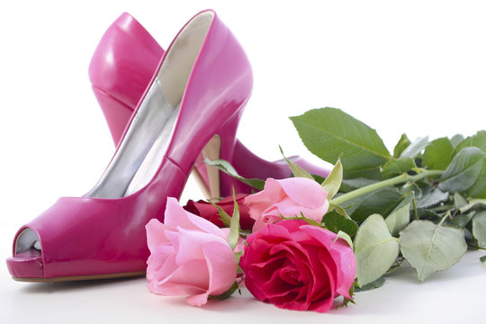 Pink high heel shoes with roses.