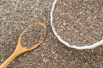 a wooden spoon of organic ground chia seeds.