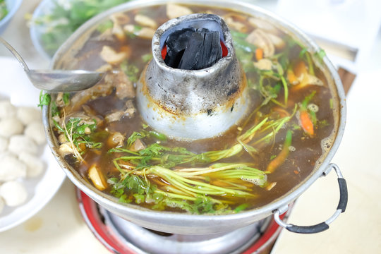 Boiling pork and many vegetable in hot pot