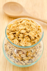 Homemade granola in open glass jar.