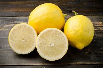 Fototapeta na wymiar Fresh lemon on wooden background