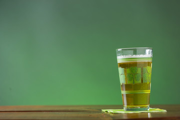 St. Patricks Day cold glass of beer on a wood background