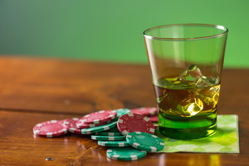 Glass of Whiskey with lucky poker chips