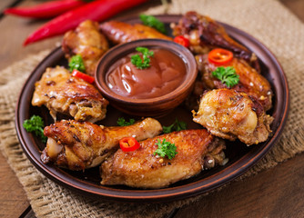 Sour-sweet baked chicken wings and sauce