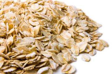 Heap of oat flakes closeup (gray shade)