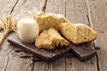 fresh homemade loaf of bread with milk