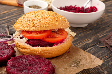 burger with beetroot on a dark rustic a wooden table