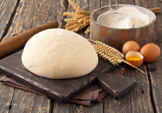 fresh dough on a wooden board