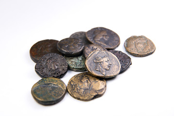Vintage coins with portraits of kings on over white