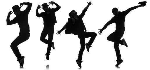 Silhouettes of dancers in dancing concept