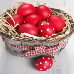 Red Easter eggs in basket