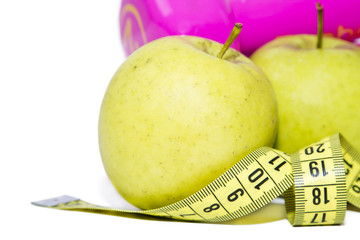 apples with measuring tape and dumbbells