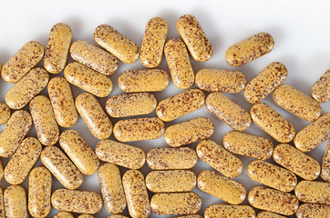 Top view of pills on a white
