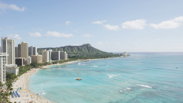 Hawaii. Waikiki beach in Honolulu on Oahu, Time lapse of the famous beach with people surfing and Diamond Head in background on tropical Oahu, Hawaii, USA. Shot on RED EPIC.