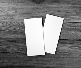 Blank flyer over wooden background to replace your design.