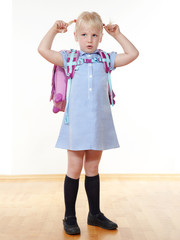 Cute child is proud to start at school
