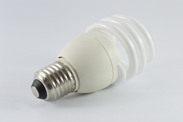 Energy saving fluorescent light bulb on white bakground