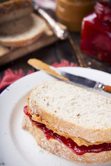 Peanut butter and jelly sandwich on a rustic table