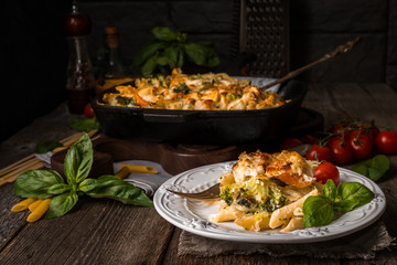 Baked pasta with broccoli, cauliflower, cheese and bechamel sauc