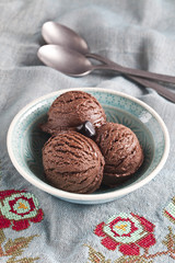 Chocolate ice cream bowl on the blue fabric.