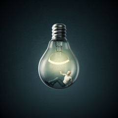 Birth of an idea / 3D render of man inside light bulb