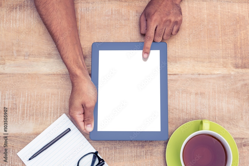 Poster cropped image of man using on digital tablet