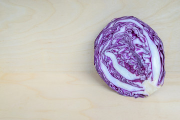 Fototapeta premium Purple cabbage on wood