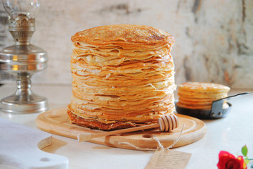 Stack pancakes on Shrove Tuesday on a light background