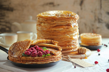 Stack pancakes on Shrove Tuesday on a light background