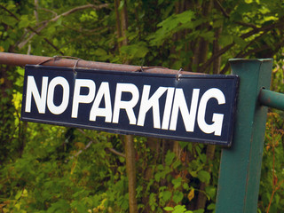 No Parking sign of fence