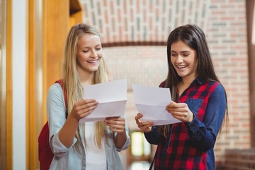 Smiling students looking at results 