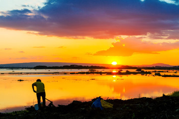 Fototapeta premium Farmer work and sunset