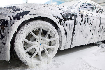 Close up detail of wash cleaning brush on car at carwash