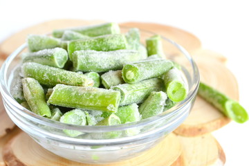 Frozen green beans in a glass bowl
