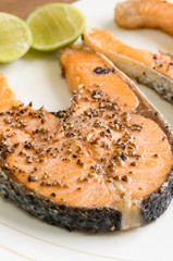 Salmon steak grilled with lemon
