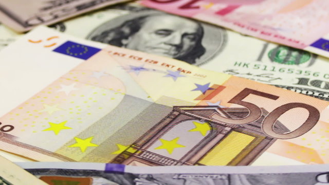 Dollars and Euro Banknotes Rotate