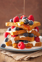 french toasts with creme fraiche and berries for breakfast