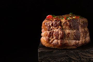 Grilled Steak Meat on the wooden surface