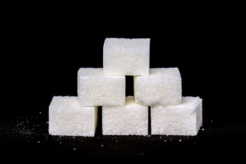 Sugar cubes on a black background
