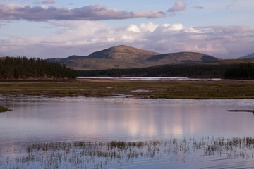 Obraz na płótnie Canvas Small lake and the mountain in the background. Lake Darpir. Yakutia. Russia.